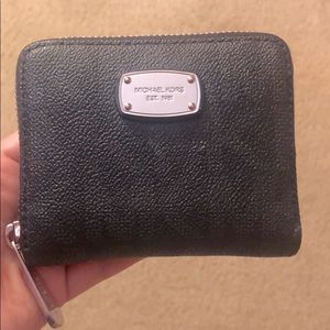 MK wallet in black. New. Sleek and space saver
